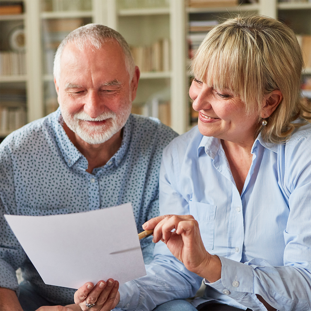 Older couple looking over document for wills and probate