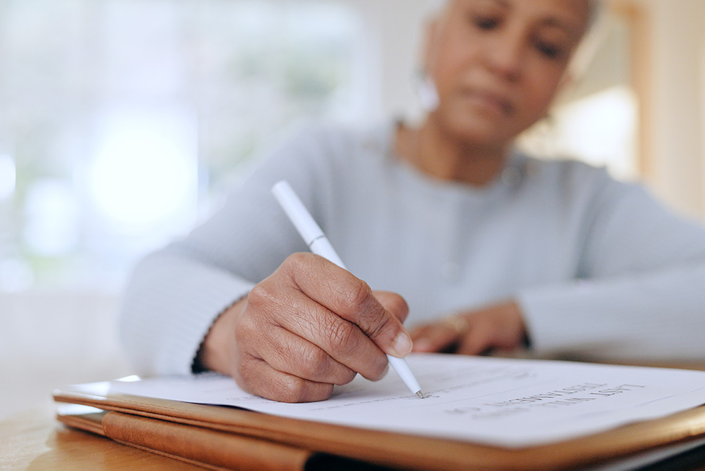 Woman signing documents